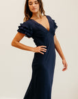 MILLE Helene Dress in Navy – model in outdoor setting