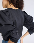 MILLE Lila Top in Black – tucked into high-waist skirt