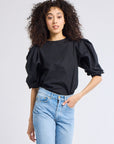 MILLE Lila Top in Black – styled with wide-leg trousers