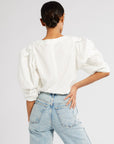 MILLE Lila Top in White – tucked into high-waist skirt